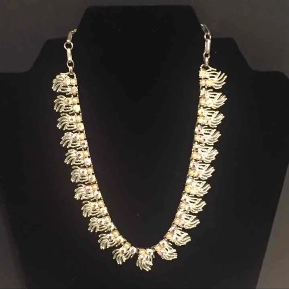 silver tone with rhinestone faux pearl choker.